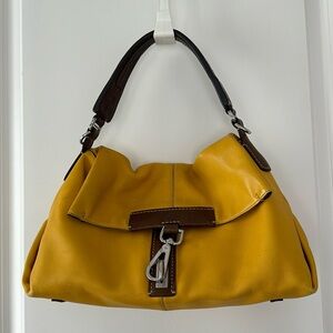 Tumi yellow bag with brown handle
